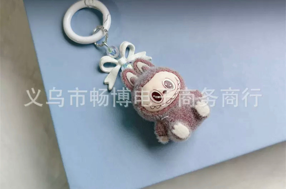 fuzzy flock sitting labubu with keychain and bow colored ,random mix