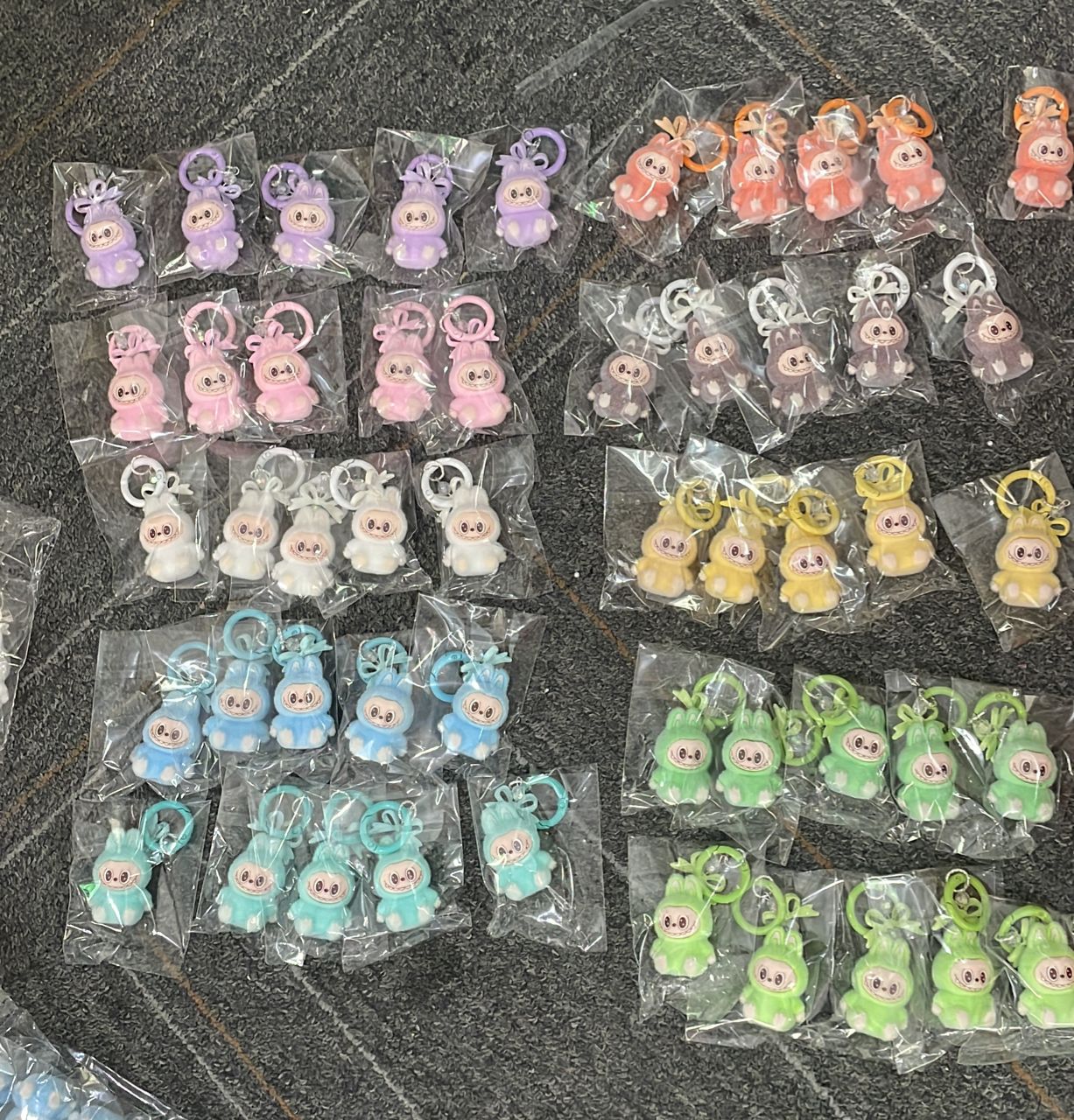 fuzzy flock sitting labubu with keychain and bow colored ,random mix