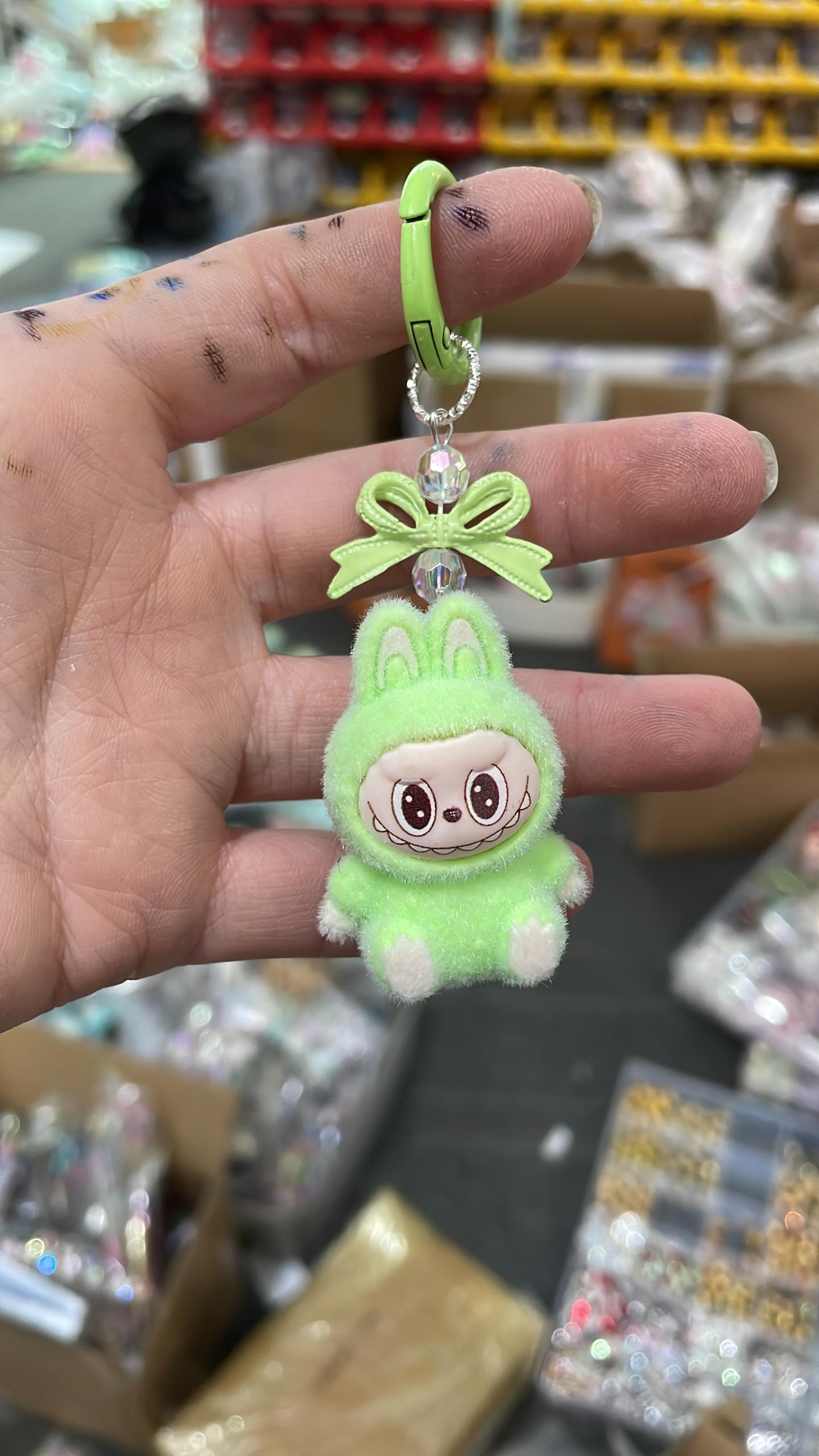 fuzzy flock sitting  labubu with keychain and bow colored ,random mix
