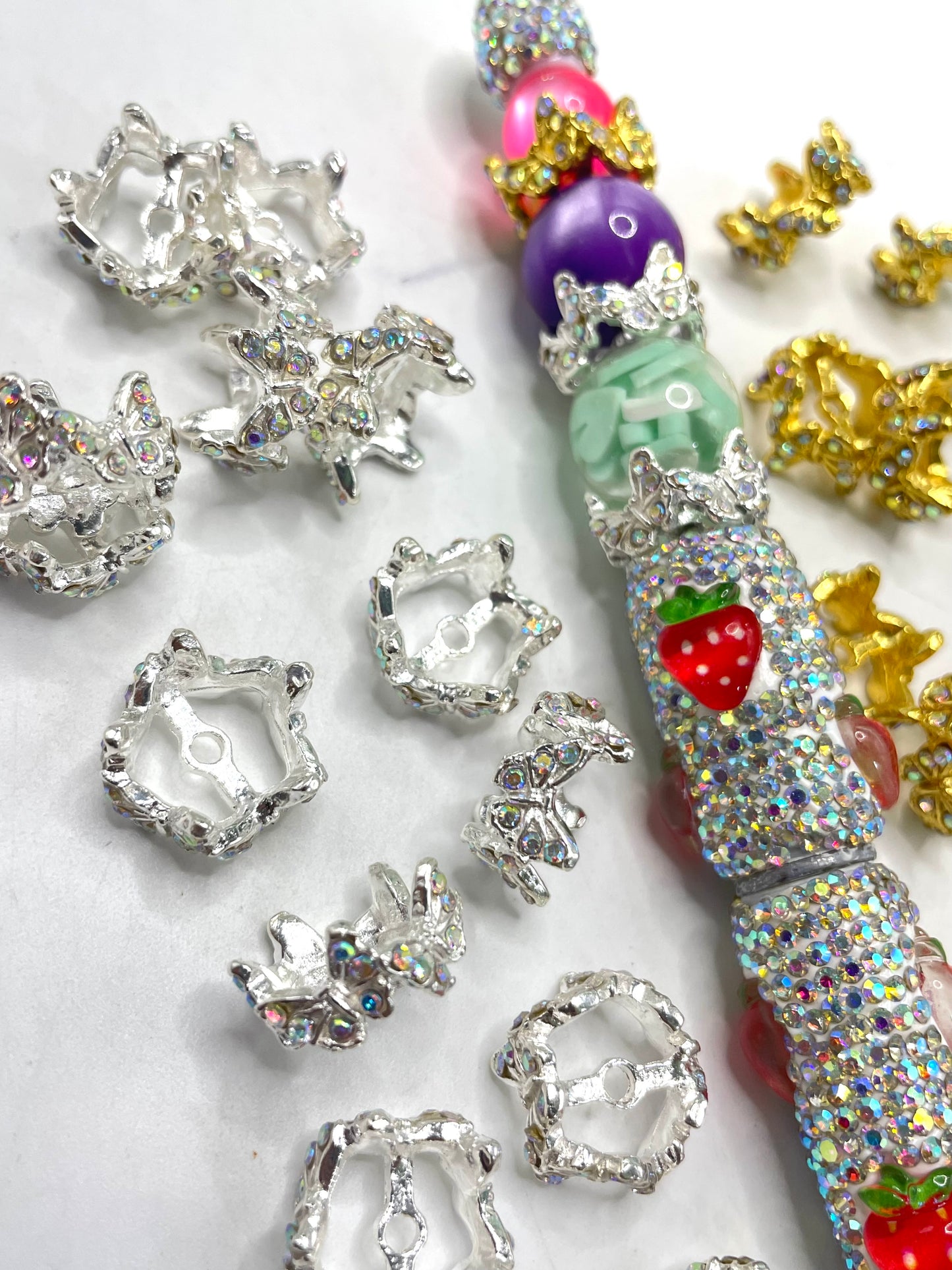 Bead spacing, with colorful brick and stone butterfly appearance Spacers
