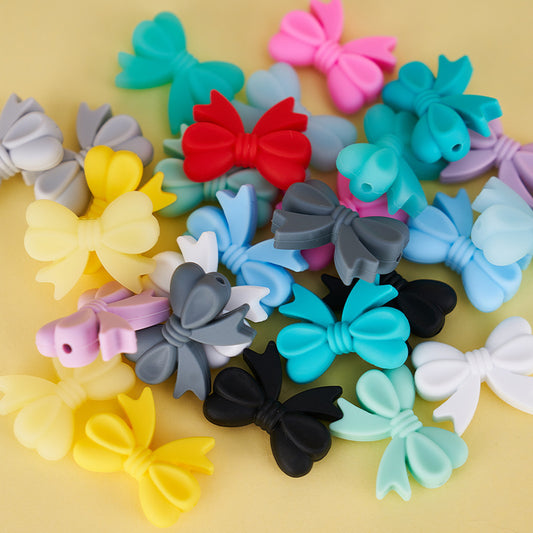 Colored perforated bows Silicone bow Random Mix beaded bow hole from left to right side bow beads for bracelet charms for phone charm
