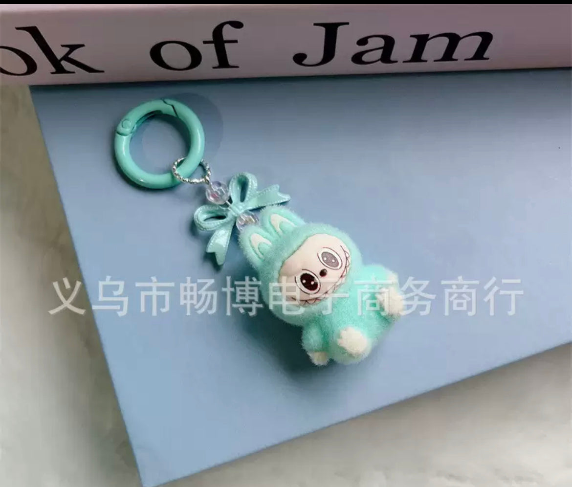 fuzzy flock sitting  labubu with keychain and bow colored ,random mix